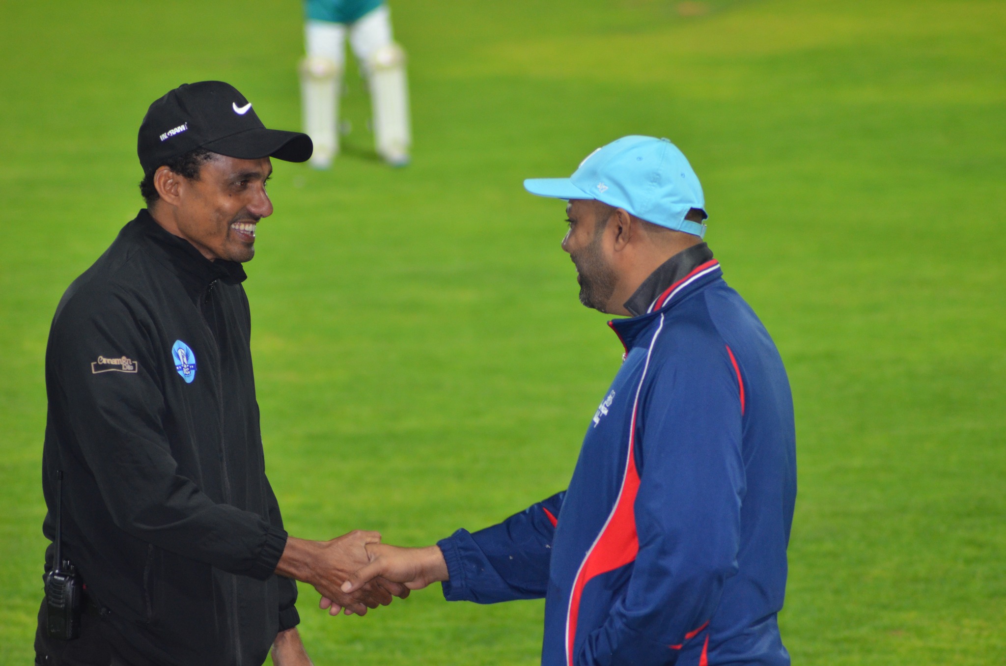 Coaches guiding young players during training